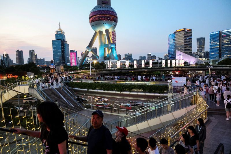 China's economy slows as consumers tighten belts, US tariff risks mount